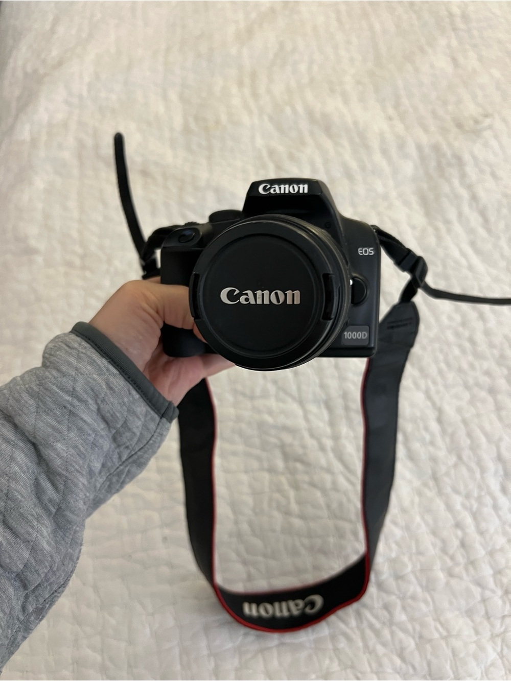 Canon EOS Rebel XS DSLR Camera in Black with Red-Trim Strap